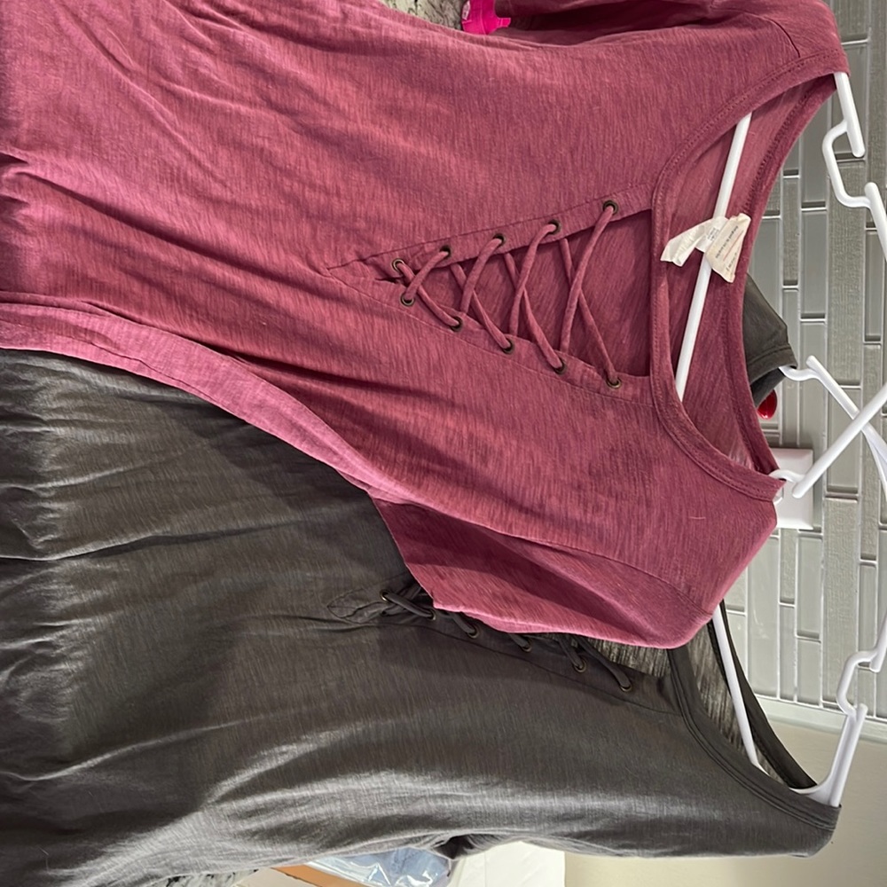 2 medium shirts with cut out